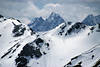 Alpengipfel Hohe Tauern in Schnee Wolken Winterfoto von Hochalpenstraße