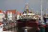 804094_Hafen von Zierikzee Schiffe an Hafenpromenade malerischen Häusern am Wasser Reisefoto