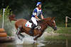001530_Nedelec, Esteban, Frankreich Reiter Sportfotos auf Matin du Neipo Pferd im Wasser dynamischer Ritt