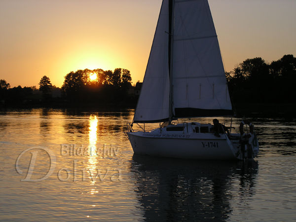 Sailing by sunset in Mazury lake-water vacation stock photography