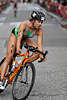 707810  Moniz aus Portugal, hbsche Portugisin  mit Rennrad in der Kurve, Radrennen bei Triathlon WM 2007 in Hamburg
