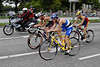 708029_ Triathlon Strassenrennen WM-07 Motorradfahrer & Mnner Trio beim Radrennen in Bewegungsfoto