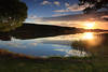 Sonnenuntergang ber See Schilfufer Wasserlandschaft Gegenlicht Romantik Naturfoto