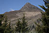 1201763_Knoten Foto mit Gipfelkreuz Blick ber  Bume in kahle Alpenlandschaft Hochgebirge nach Winter