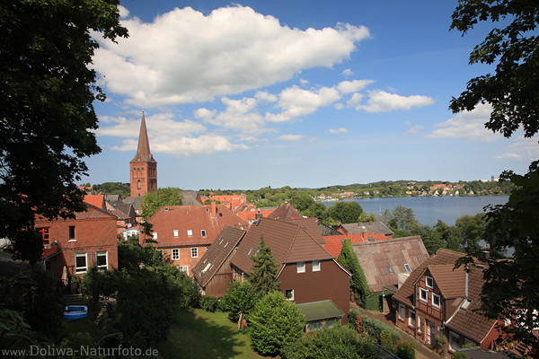 Ploen city view housetop church tower over lake water landscape skyline