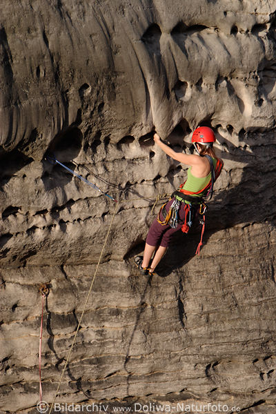 Climber-Lady climbs photo on rock Prachovske skály Czech-paradise mountains
