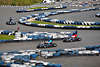 1100203_ Karting Autorennen Sportbild auf Kartbahn in Bispingen zwischen weiss-blauen Autoreifen