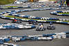 1100209_ Karting Fotografie in Kurve auf Kartbahn Asphaltbelag aus Reifen beim Autorennen Bild