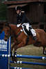 000915_Sprung-Portrt im Pferdesattel bewegtes Foto junges Mdchen Ponyreiten Sportbild vom Parcours