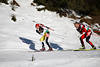 Slowake Pavol Hurajt Foto vor sterreicher Daniel Mesotitsch Biathletenpaar Schatten auf Schneeloipe skifahren