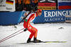 815111_China Biathlete sport-picture Zhang Chengye in red skiing portrait on snow World-Cup ski-loipe